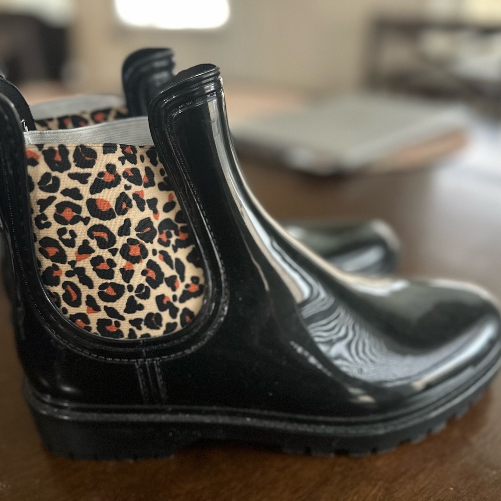 Used Black with cheetah rain boots. Size 10 women